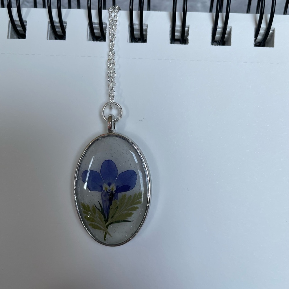 Oval Pendant Necklace with Blue Flower
